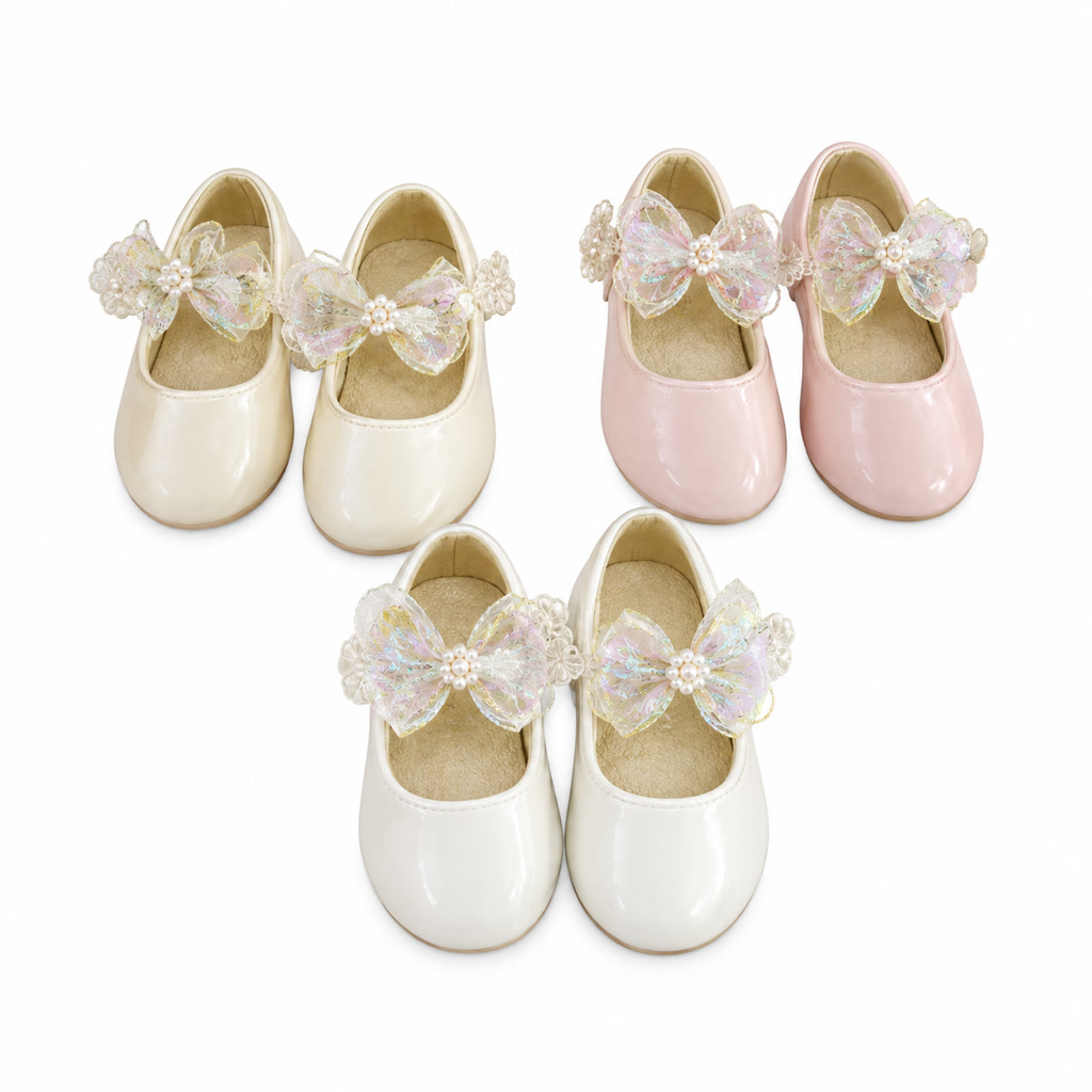 Zapato de charol para niña con moño de tela y adorno redondo